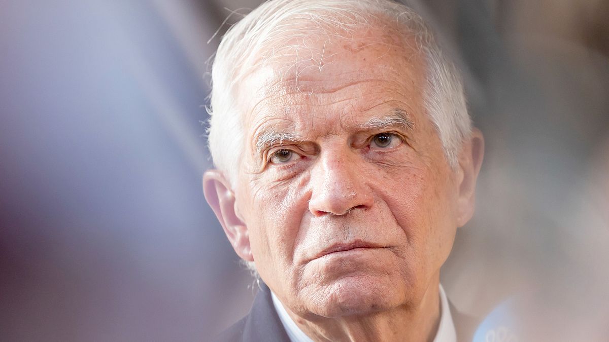 European Union foreign policy chief Josep Borrell talks with journalists as he arrives for a meeting at the European Council building in Brussels, 22 July 2024