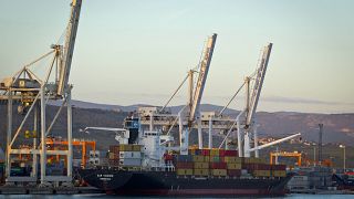 Cranes and a cargo ship are seen in the port of Koper, Slovenia. Sept. 25, 2012. 