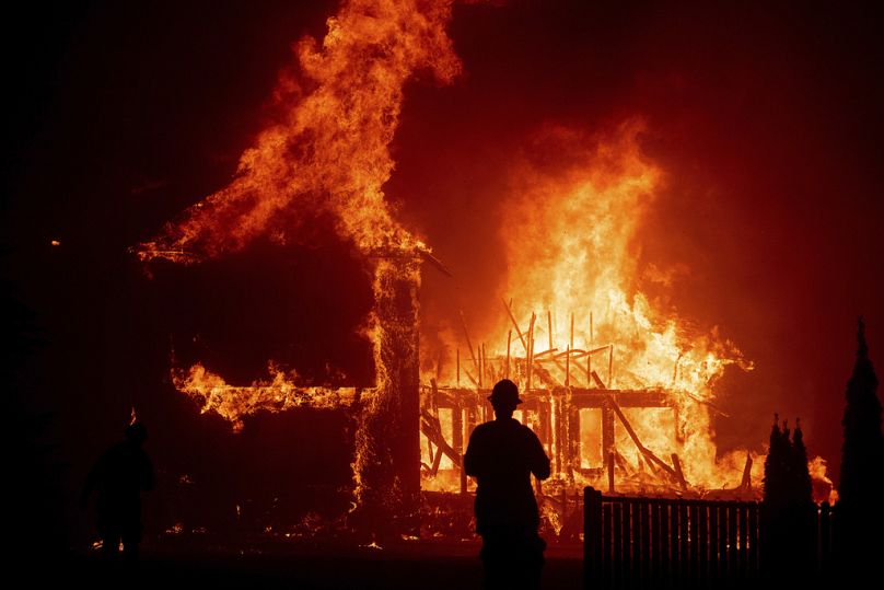 A home burns as the devastating Camp Fire rages through Paradise, California in November 2018