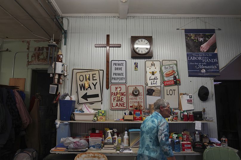 Sister Helen Mueting walks through the community's workshop at the Mount St. Scholastica Benedictine monastery. 