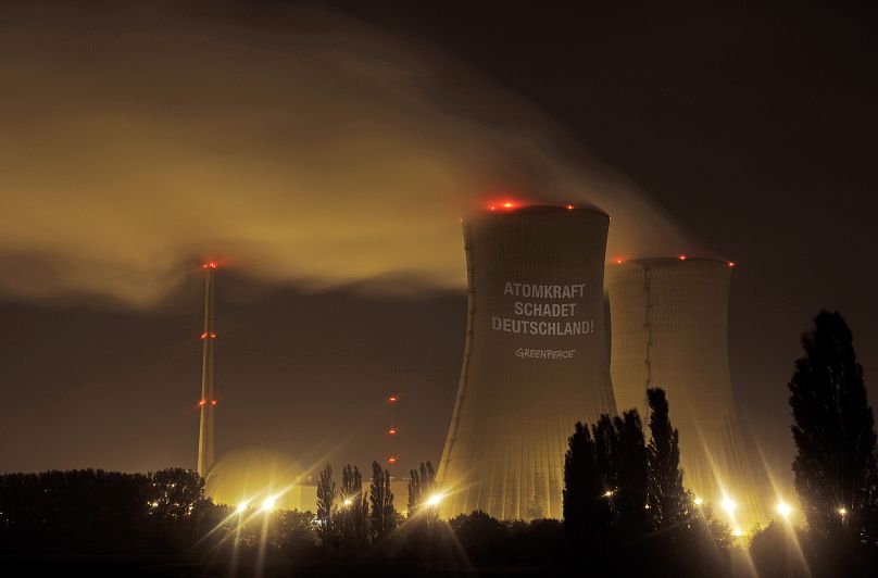 'Nuclear power harms Germany' is the Greenpeace message projected on the cooling systems of the nuclear power plant in Grafenrheinfeld, September 28, 2010