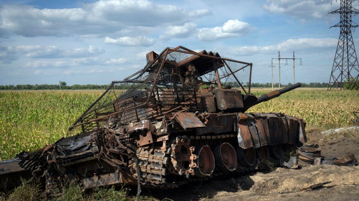 A destroyed Russian tank lies on a roadside near Sudzha, Kursk region