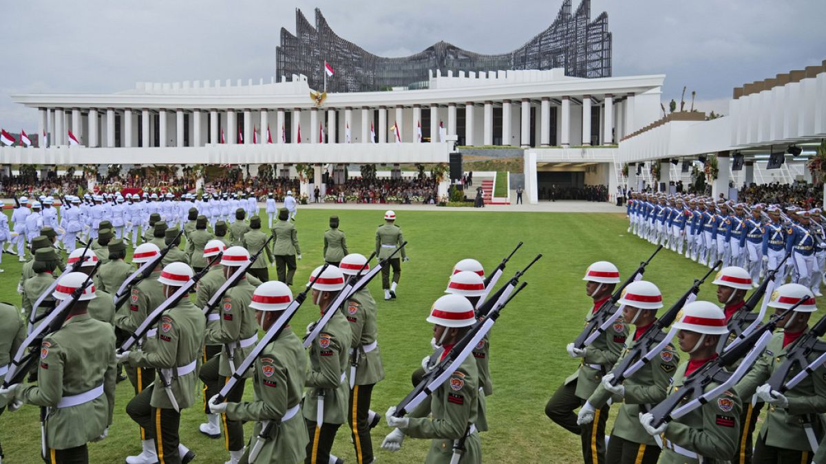  Soldiers march before the start of a ceremony marking Indonesia's 79th anniversary of the independence at the new presidential palace in its future capital city of Nusantara.