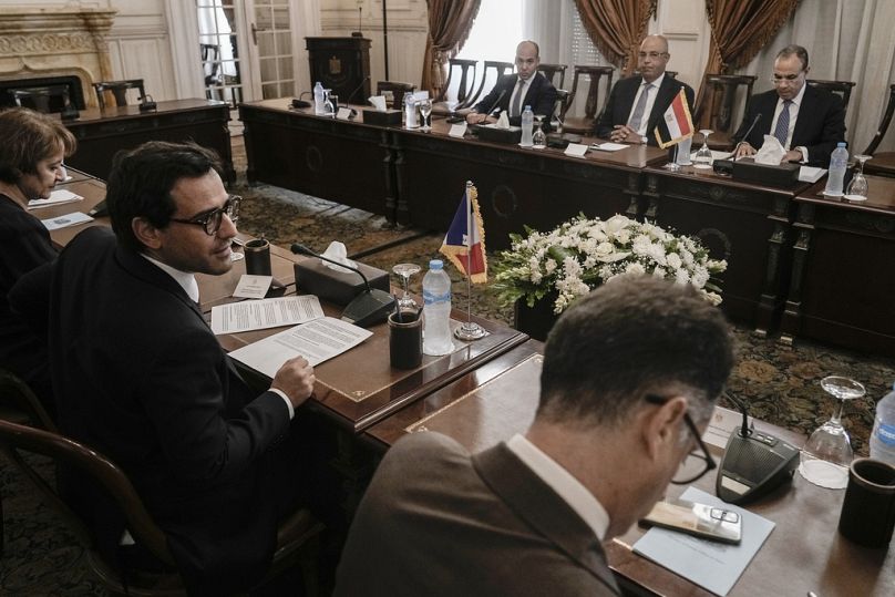 French Foreign Minister Stephane Sejourne, left, listens to his Egyptian counterpart Badr Abdelatty during their talk at Tahrir palace in Cairo.