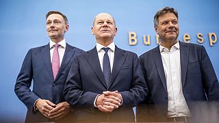 German Chancellor Olaf Scholz, center, German Minister for Economic Affairs and Climate Protection Robert Habeck, left, and German Minister of Finance Christian Lindner.