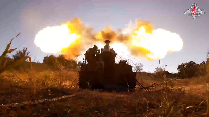 In this photo taken from video released by the Russian Defense Ministry on Sunday, Aug. 18, 2024, Russian soldiers fire Giatsint-S self-propelled gun towards Ukrainian positio