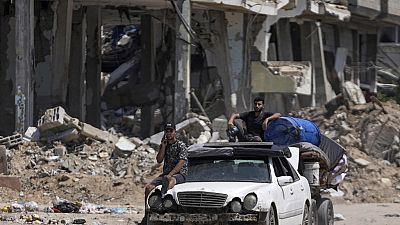 Palestinians evacuate Maghazi refugee camp in the central Gaza Strip, as part of a mass evacuation ordered by the Israeli military ahead of an operation, Saturday, Aug. 17, 20