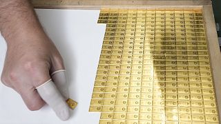 Investment gold bars being arranged for storage at the Mint of Poland, in Warsaw, Poland