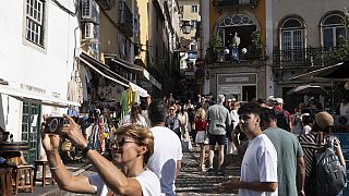 Tourists visit the old Lisbon centre of Sintra, Portugal, Friday, August 9, 2024.