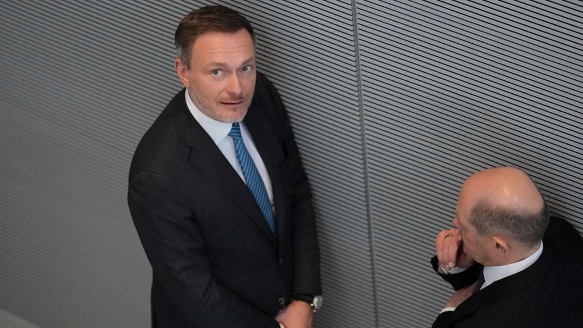 German Chancellor Olaf Scholz, right, talks to German Finance Minister Christian Lindner, left, during a debate at the German parliament Bundestag in Berlin, March 20, 2024