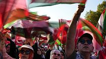 Demonstrators chant slogans while holding Palestinian and Turkish flags during a rally in support of Palestinians in Gaza, in Istanbul, Turkey, Saturday, Aug. 3, 2024.