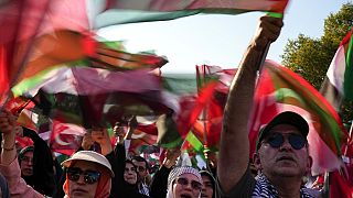 Demonstrators chant slogans while holding Palestinian and Turkish flags during a rally in support of Palestinians in Gaza, in Istanbul, Turkey, Saturday, Aug. 3, 2024.