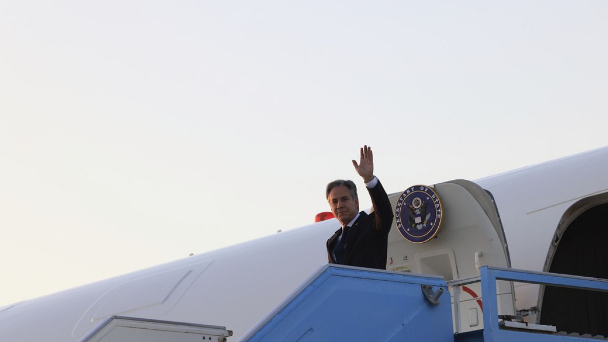 U.S. Secretary of State Antony Blinken waves as he disembarks from his plane in Tel Aviv, Israel, Sunday, Aug. 18, 2024. 