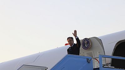 U.S. Secretary of State Antony Blinken waves as he disembarks from his plane in Tel Aviv, Israel, Sunday, Aug. 18, 2024. 