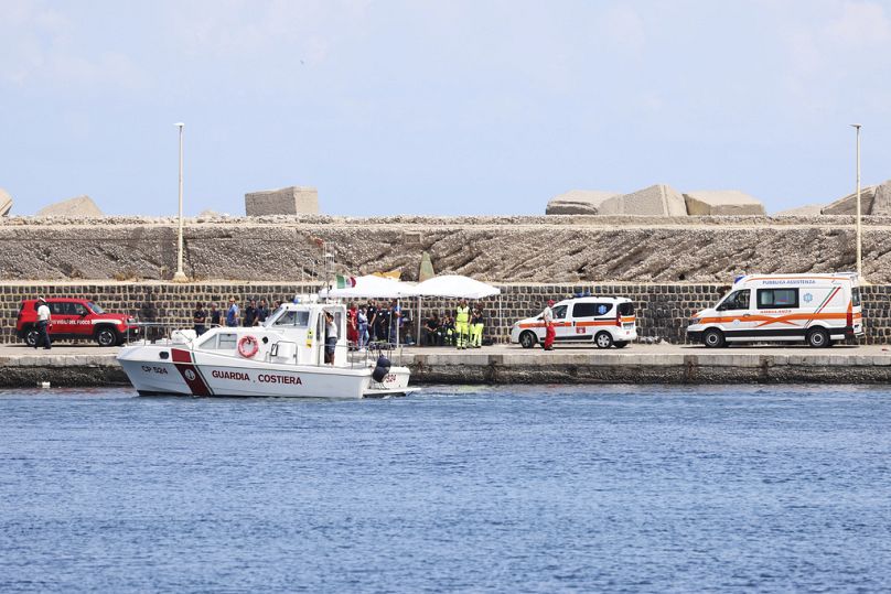 Emergency services at the scene of the search for a missing boat, in Porticello Santa Flavia, Italy, Monday, Aug. 19, 2024