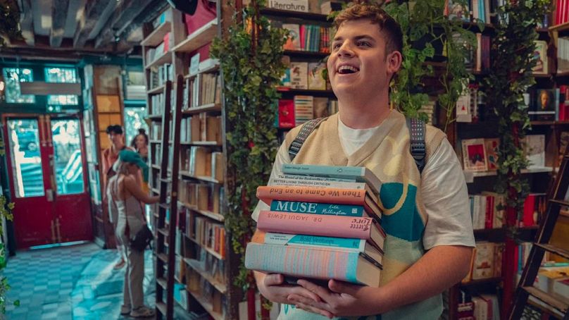 The character of Isaac (Tobie Donovan) reading Queer books in Netflix hit tv series, Heartstopper. 