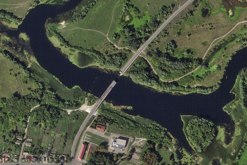 A satellite photo shows a destroyed bridge across the Seim River at the town of Glushkovo in Russia's Kursk region