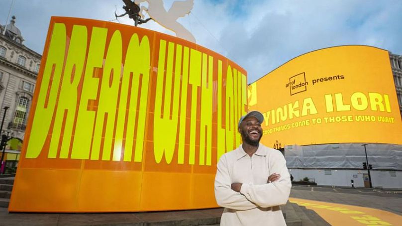 Yinka Ilori with his installation “Good Things Come To Those Who Wait”