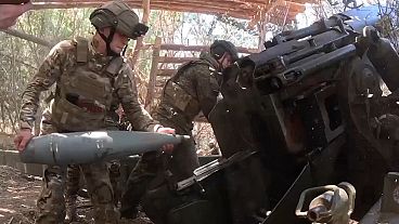 Russian soldiers fire a Giatsint-B gun towards Ukrainian positions at an undisclosed location in Ukraine's Kherson region. Russian soldiers fire a Giatsint-B gun towards Ukrainian positions at an undisclosed location in Ukraine's Kherson region.