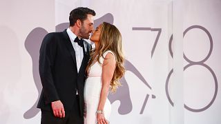 Jennifer Lopez, right, and Ben Affleck kiss at the premiere of the film "The Last Duel" during the Venice Film Festival in Venice, Italy, on Sept. 10, 2021