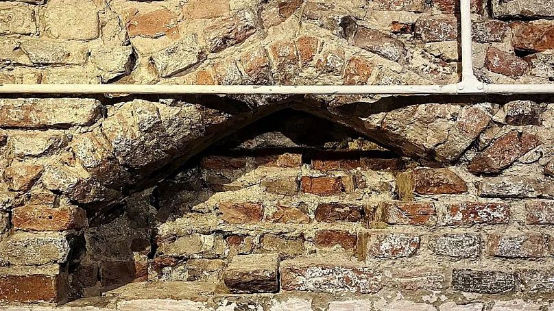 The top of the 15th century archway uncovered behind a wall in St George's Guildhall, King's Lynn.