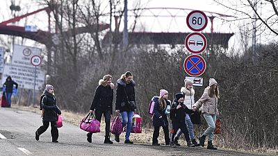 Ukrainian refugees crossing the border into HUngary the day after Russia's full-scale invasion on 24 February 2022