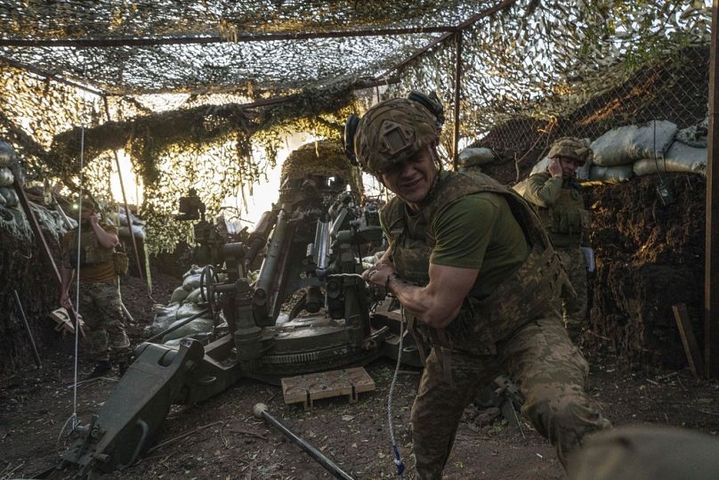 A Ukrainian serviceman Oleh of 148th separate artillery brigade of the Air Assault Forces fires towards Russian positions by a M777 howitzer at the frontline in Donetsk region