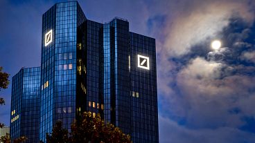 File photo. The moon shines next to the headquarters of the Deutsche Bank in Frankfurt, Germany. 4 October 2020.