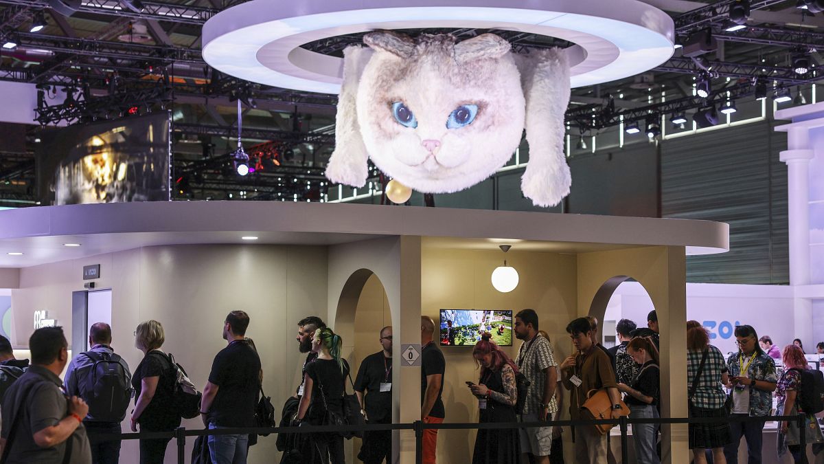 Computer gamers line up at the stand for the game inzoi at the Gamescom computer gaming fair in Cologne, Germany, Wednesday, 21 August 2024. 