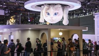 Computer gamers line up at the stand for the game inzoi at the Gamescom computer gaming fair in Cologne, Germany, Wednesday, 21 August 2024. 