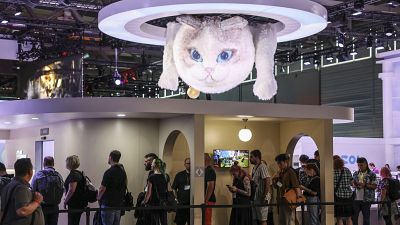 Computer gamers line up at the stand for the game inzoi at the Gamescom computer gaming fair in Cologne, Germany, Wednesday, 21 August 2024. 