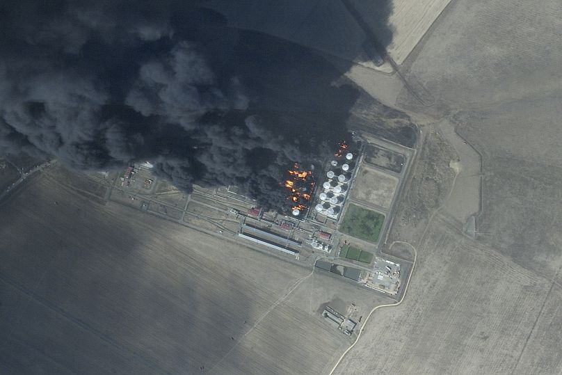 This satellite photo from Planet Labs PBC shows a fire at an oil depot earlier hit by a Ukrainian drone attack near Proletarsk, August 19, 2024