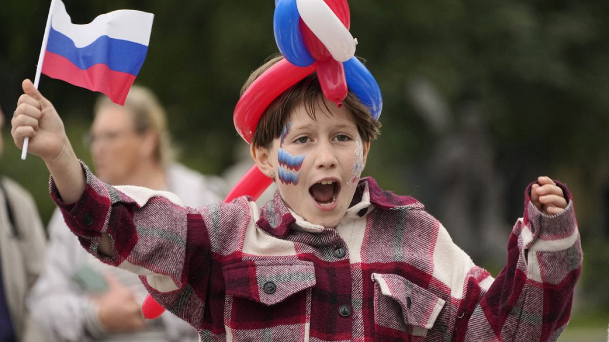 A girl attends celebrations of the Russian National Flag day in St Petersburg