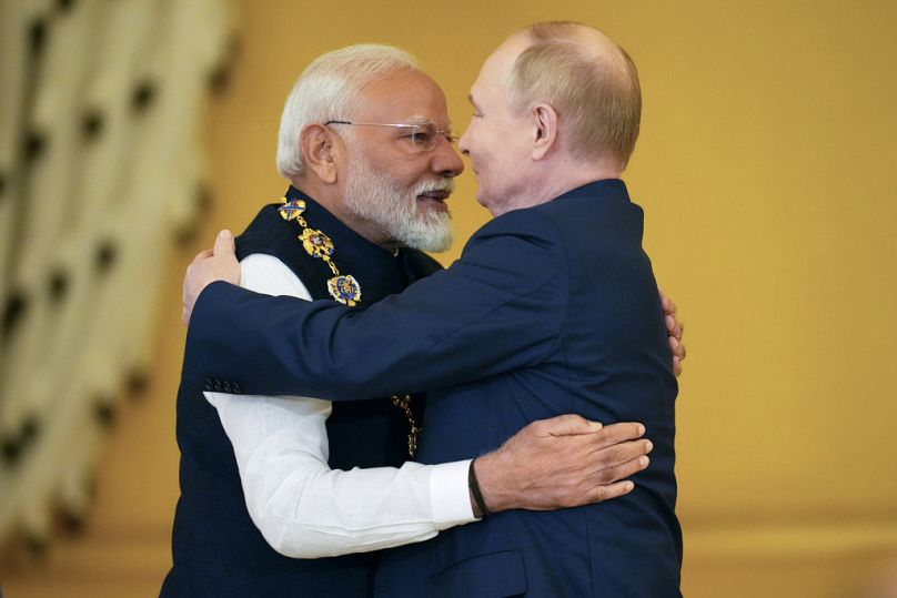 Russian President Vladimir Putin, right, awards Indian Prime Minister Narendra Modi with the Order of St. Andrew the Apostle the First-Called at the Kremlin on July 9, 2024