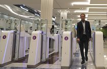 A man goes through an automated gate at Dubai Airport, in the United Arab Emirates, Sunday March 7, 2021. 