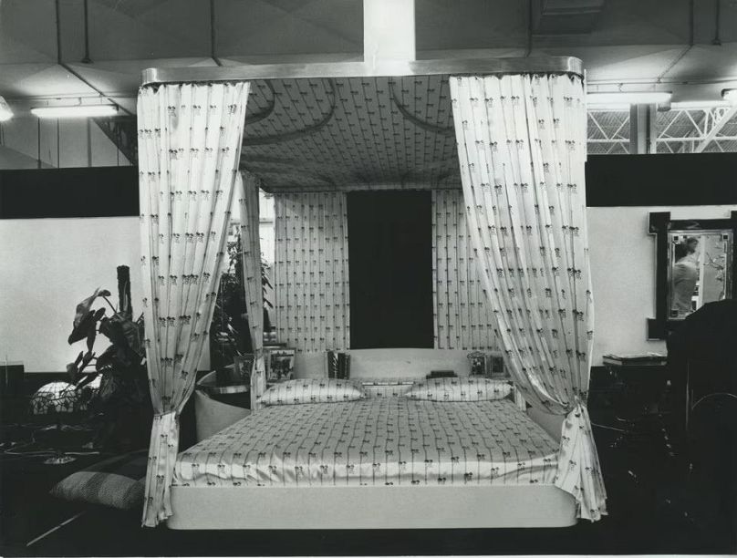 Canopied bed with components in briar and poplar with polished brass fittings, designed by Alain Delon, 1975. 