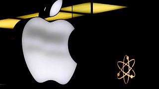 FILE - The Apple logo is illuminated at a store in Munich, Germany, Nov. 13, 2023.