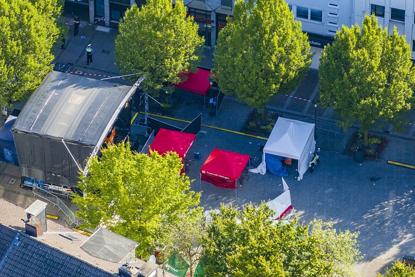 Emergency services tents stand in front of the stage in Solingen city center, Germany, Saturday Aug. 24, 2024, after three people were killed and at least eight people injured