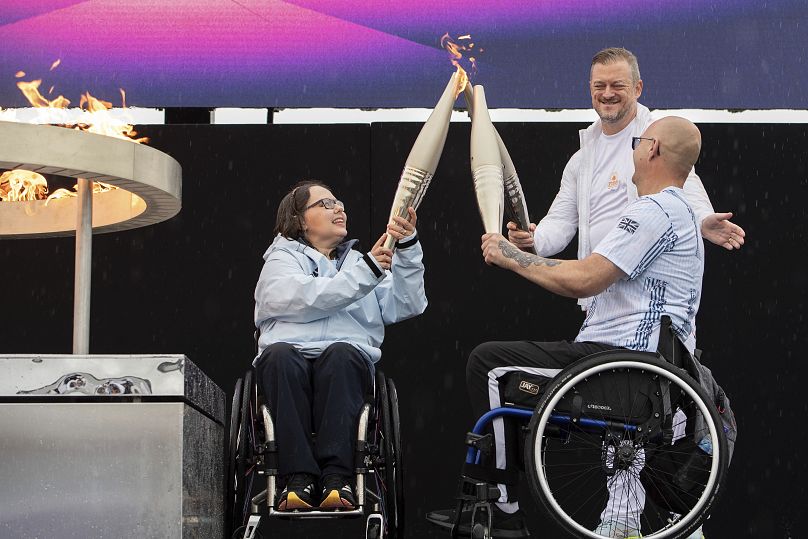 British Paralympians Helene Raynsford and Gregor Ewan light the Paralympic Flame in Stoke Mandeville, the birthplace of the Paralympic Games, on Saturday, 24 August 2024.