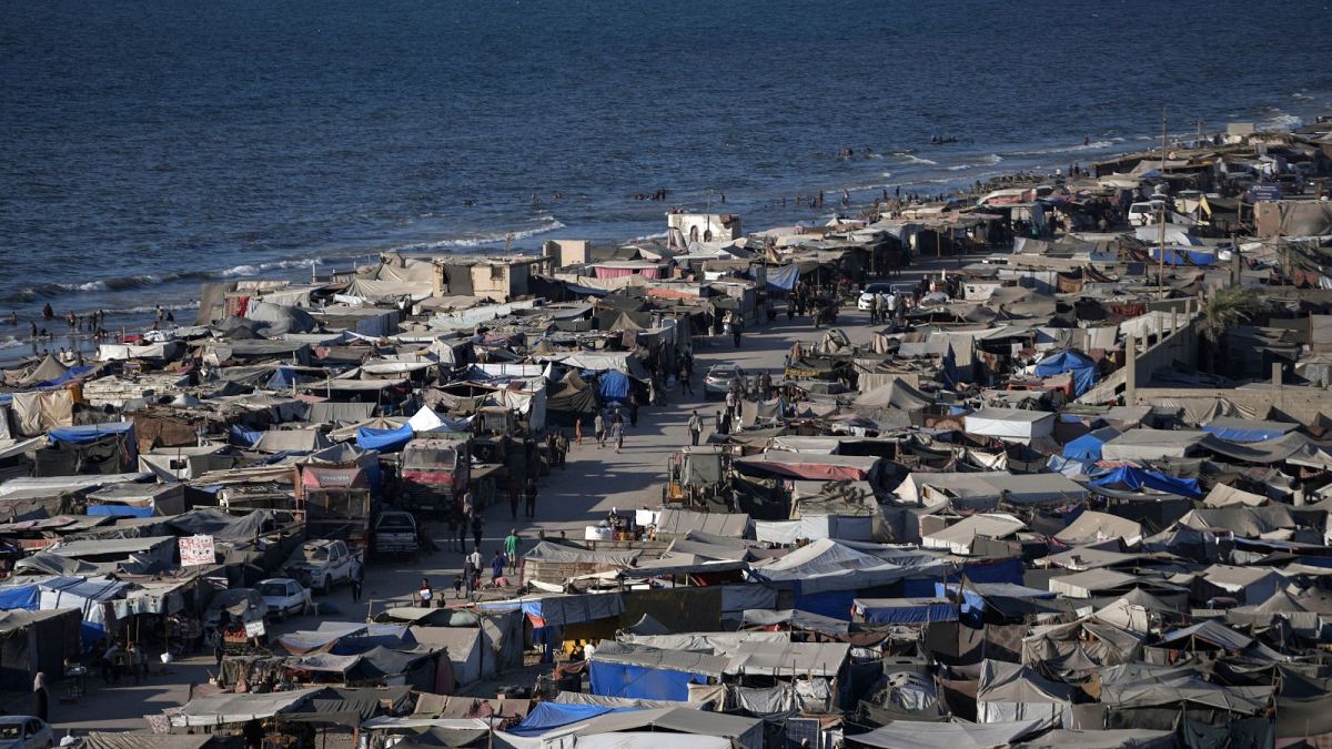 Tents are crammed together as displaced Palestinians camp on the beach, west of Deir al-Balah, Gaza Strip