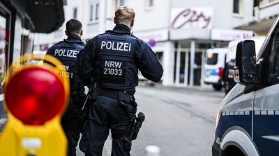 Police officers stand at a cordon in Solingen city centre following a knife attack on Friday, August 24, 2024