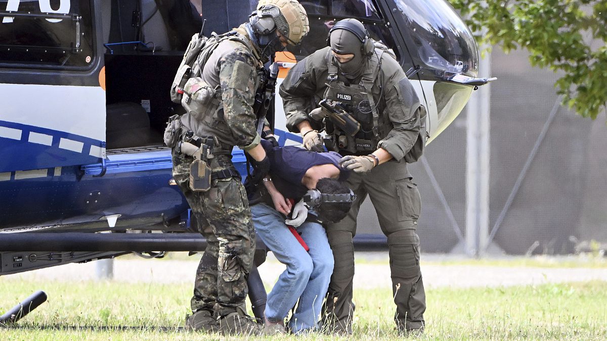 The alleged perpetrator of the knife attack in Solingen is escorted from a helicopter in Karlsruhe, August 25, 2024