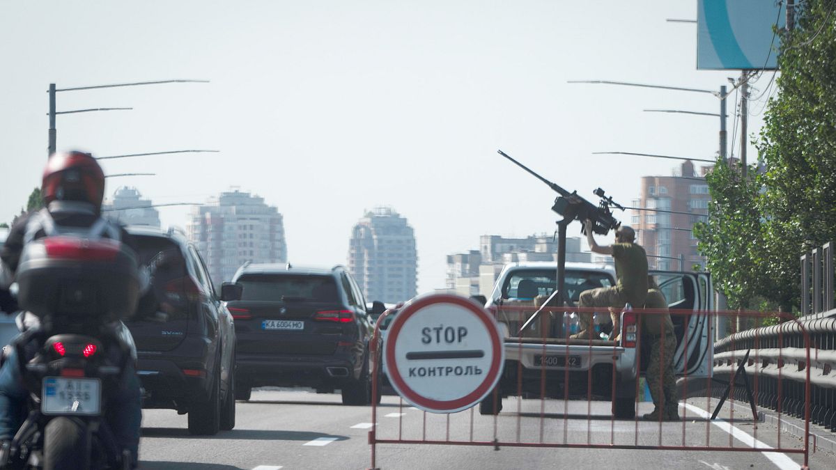 Ukrainian soldiers guard the sky with a machine gun during one of Russian most massive missile and drone attack against Ukraine's energy grid in Kyiv, 26 August 2024