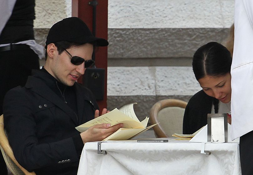 In this photo taken Saturday, May 19, 2012, Pavel Durov, founder of Russia's leading social network VKontakte, or "in contact", sits in a cafe in Red Square in Moscow, Russia.