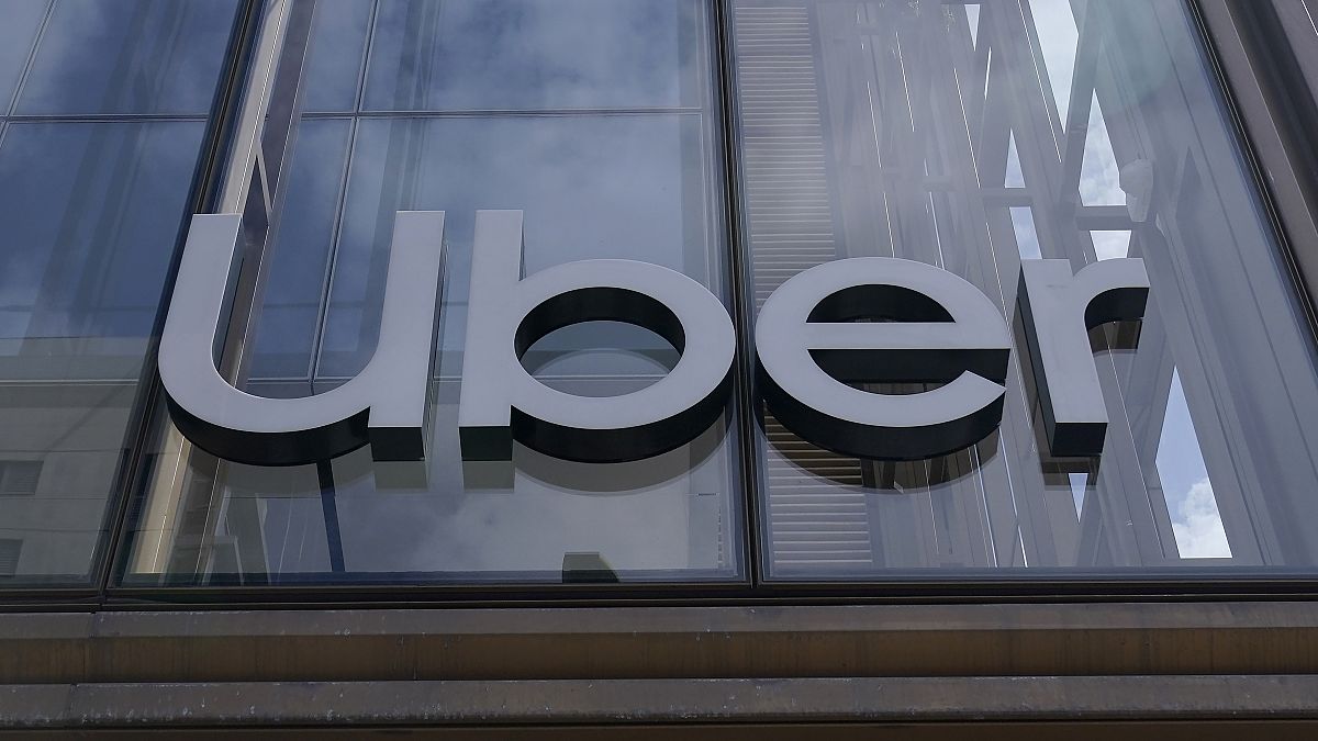 FILE - An Uber sign is displayed at the company's headquarters in San Francisco, Sept. 12, 2022. 