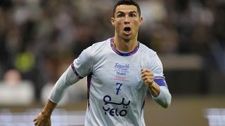 Cristiano Ronaldo celebrates after scoring his side's first goal playing for a combined XI of Saudi Arabian teams Al Nassr and PSG during a friendly soccer match.