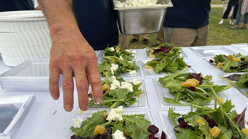 Joshua Freshwater, 53, places feta cheese on salads during a five-course dinner event at the Grafton Reintegration Centre