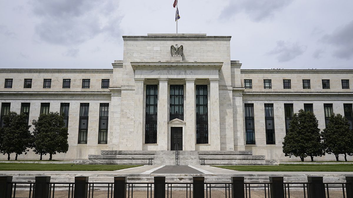 An American flag flies over the Federal Reserve building, Tuesday, May 4, 2021, in Washington.