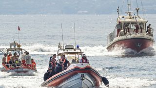 FILE - Italian firefighter divers work at the site of a shipwreck, in Porticello, Sicily, southern Italy, Thursday, Aug. 22, 2024.