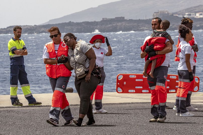 Migrants disembark at the port of "La Estaca" in Valverde at the Canary island of El Hierro, Spain, Monday, Aug. 26, 2024, after a thirteen-day voyage by boat from the coast o